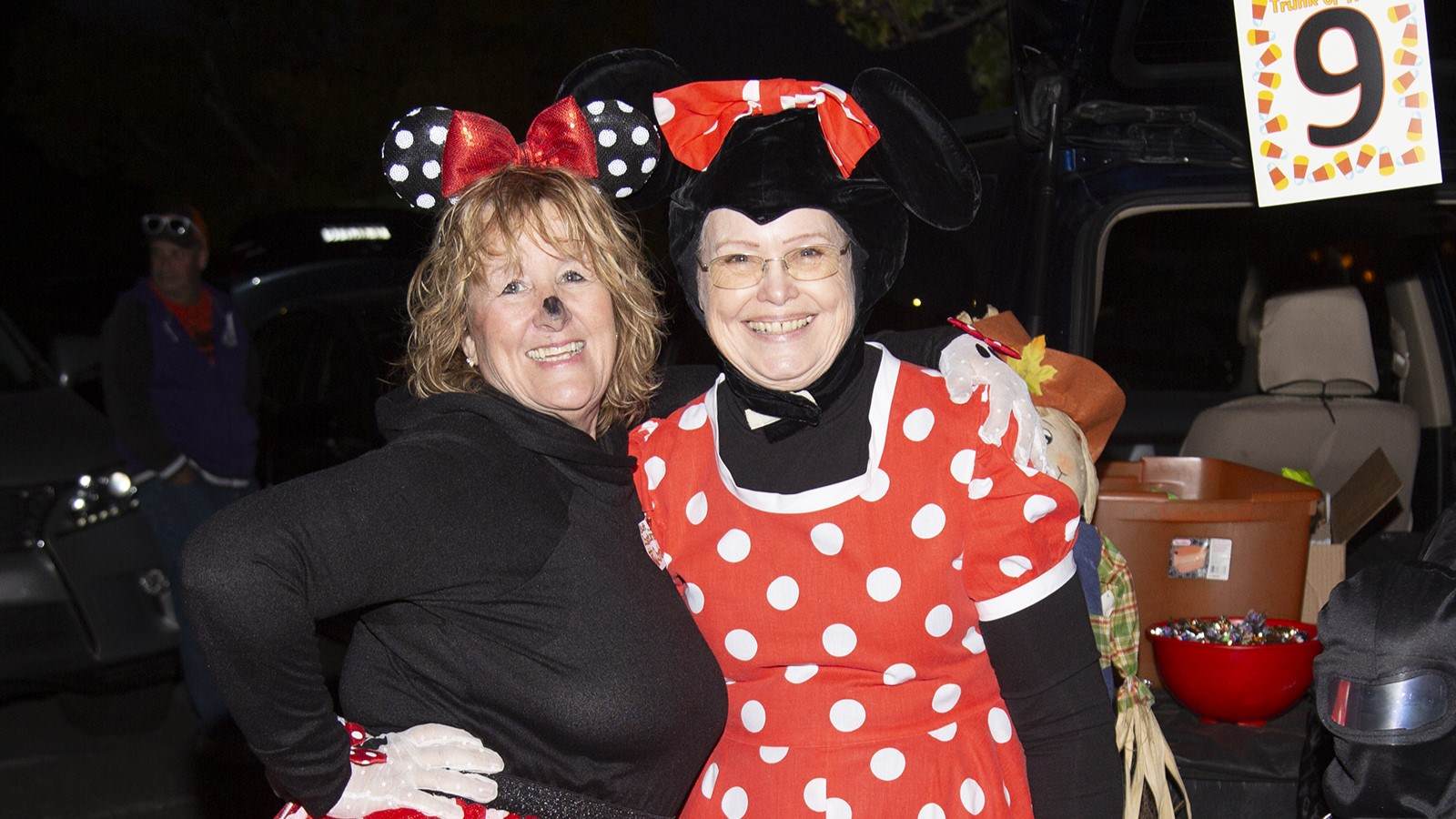 Two women dressed as Minnie Mouse for Halloween.